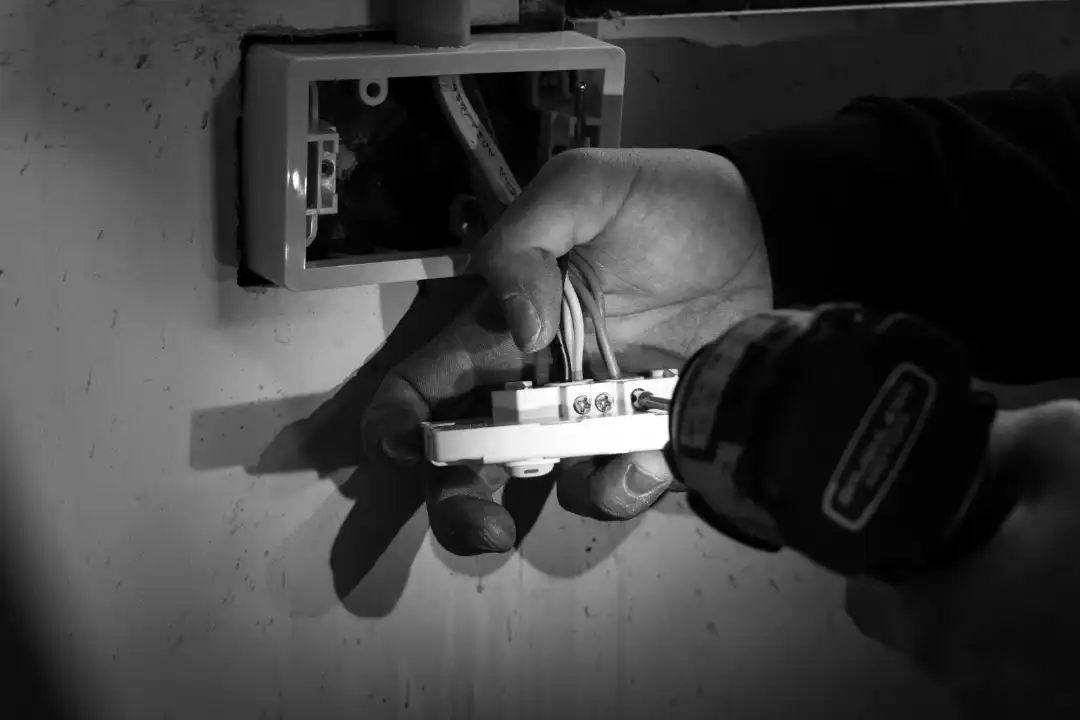 AIF Electrical team member completing electrical work